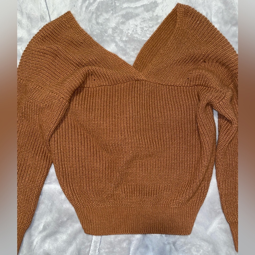 Off the shoulder, open back sweater